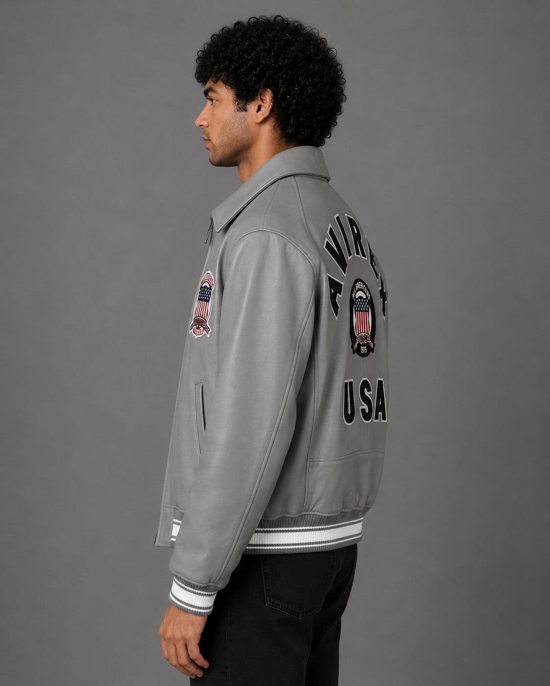 Side profile of grey sheepskin leather varsity bomber jacket