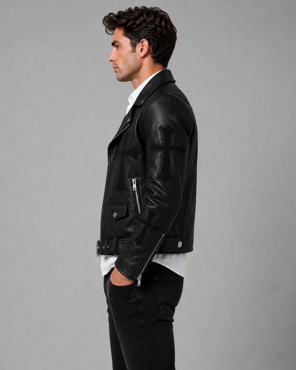 Side profile of black gothic biker jacket with stitched crosses. by avanzar leather