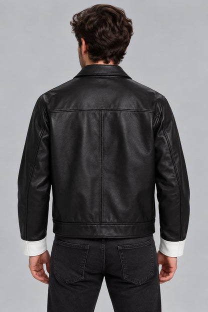 Men’s black and white lambskin leather color block biker jacket back view with bold color block design and clean leather finish