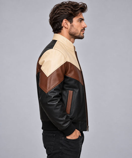 Men’s black, brown and beige genuine leather color block bomber jacket side view showing structured fit, contrasting leather panels and ribbed cuffs