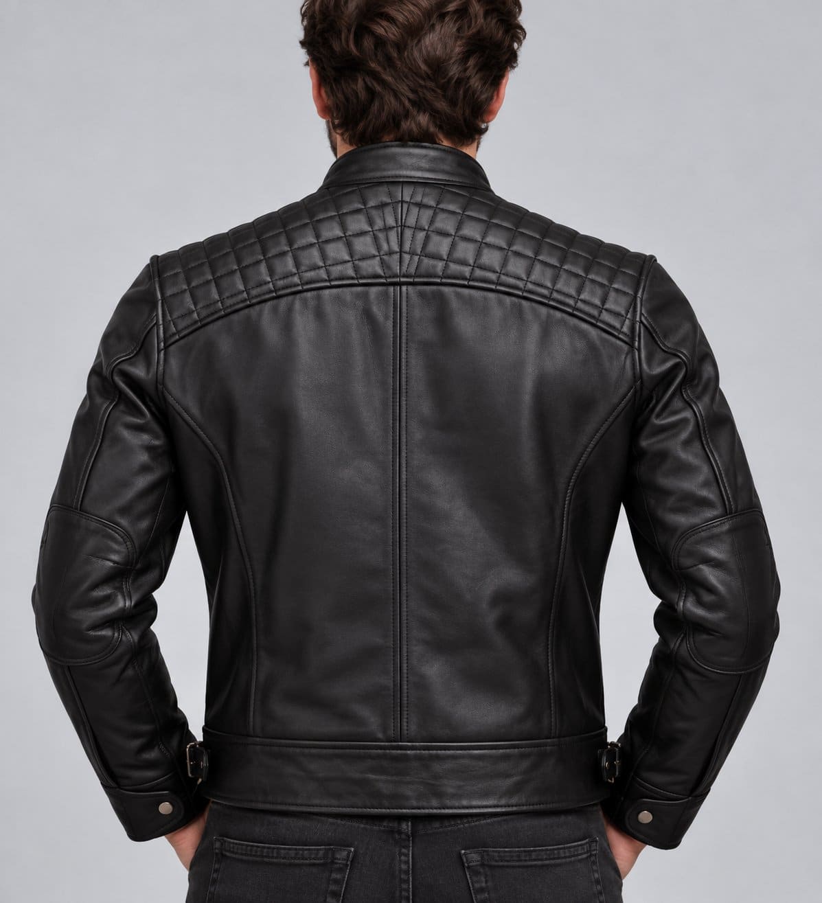 Men’s black genuine leather biker jacket back view with quilted shoulder detailing and clean leather finish