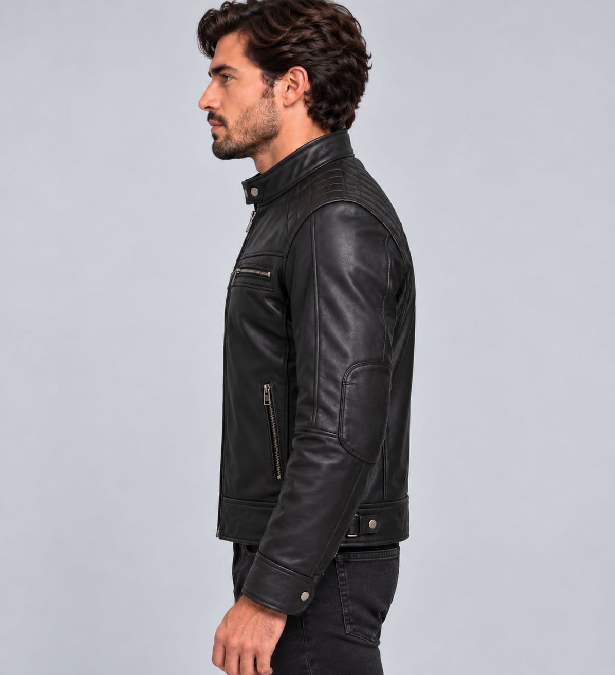 Men’s black genuine leather biker jacket side view showing quilted shoulder panels, long sleeves and fitted biker silhouette