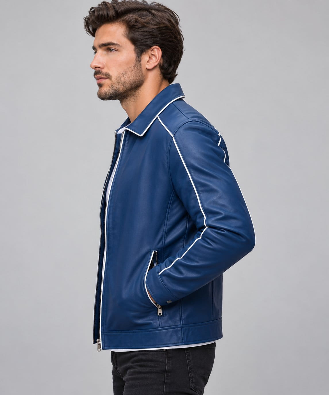 Men’s blue genuine leather varsity bomber jacket side view showing structured fit, long sleeves and ribbed cuffs