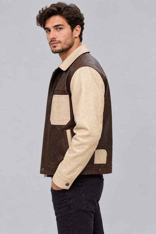 Men’s brown and beige lambskin leather trucker jacket side view showing structured fit, long sleeves and contrasting leather panels