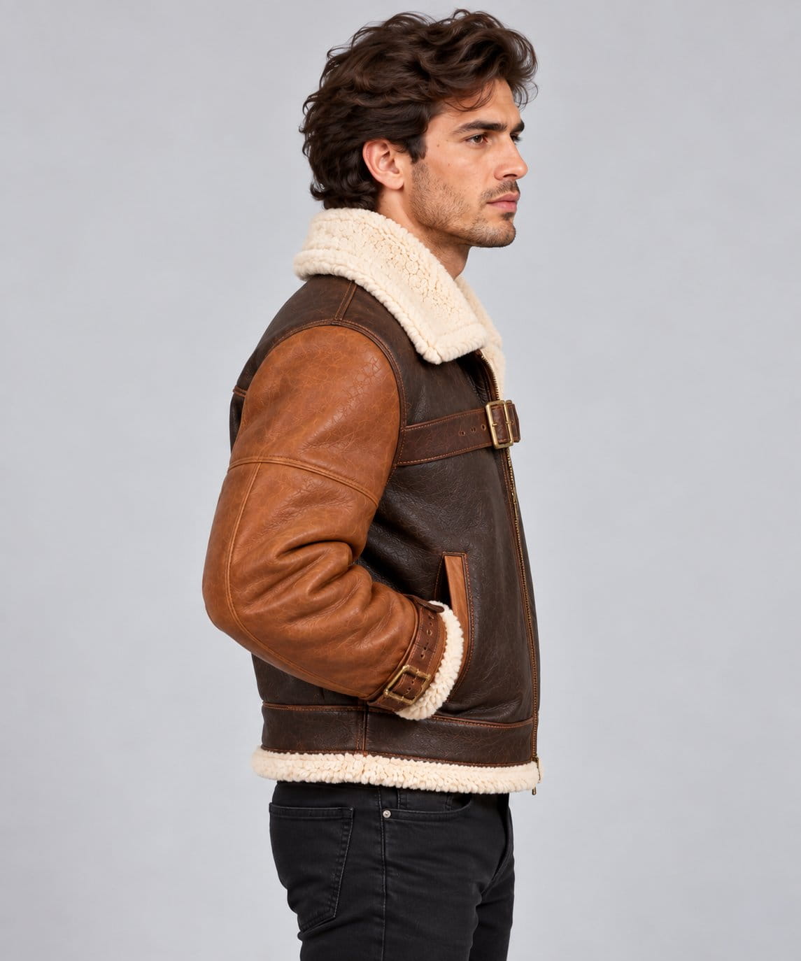 Men’s brown genuine sheepskin leather aviator bomber jacket side view showing shearling collar, long sleeves and structured bomber fit