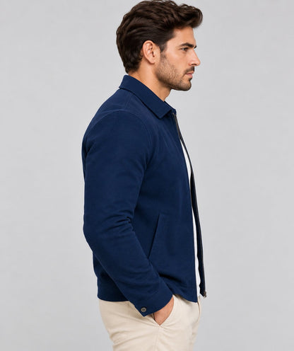 Men’s navy blue sheepskin suede leather biker jacket side view showing structured fit, long sleeves, collar and pocket detailing