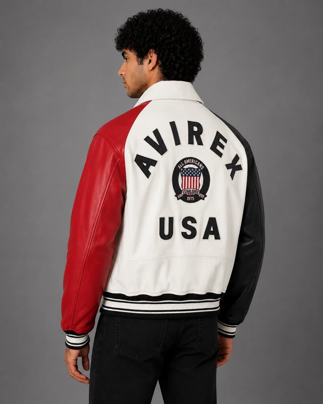 Back view multicolor Avirex bomber jacket with embroidered patches