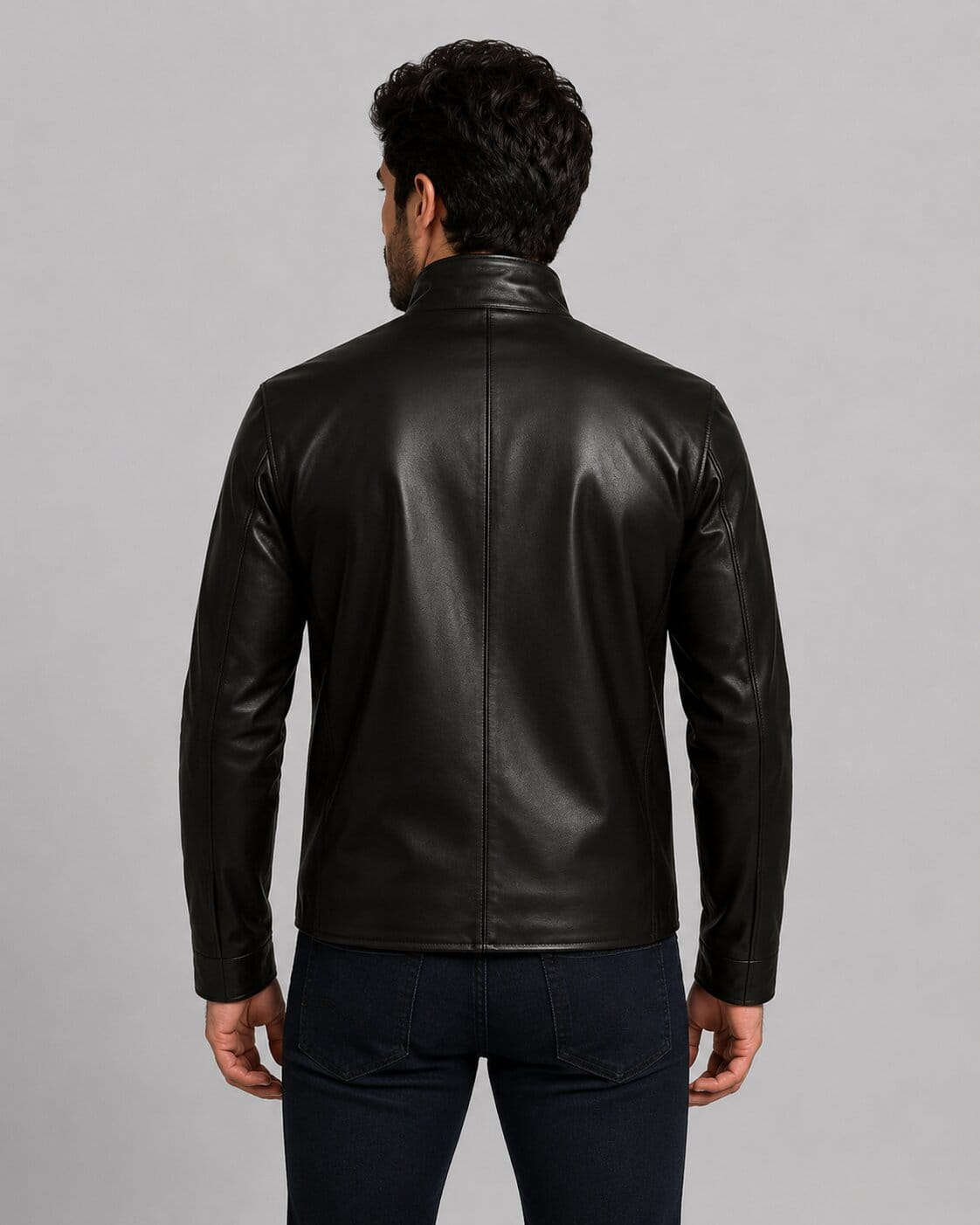 back view of the black real leather Punisher biker jacket featuring the white skull emblem on the chest and a closed zipper by avanzar leather.