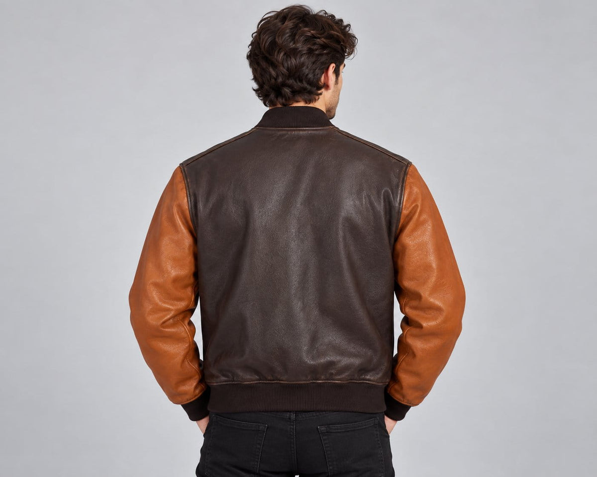 Two tone genuine leather oversized bomber jacket back view with contrasting sleeve design, clean leather finish and ribbed hem