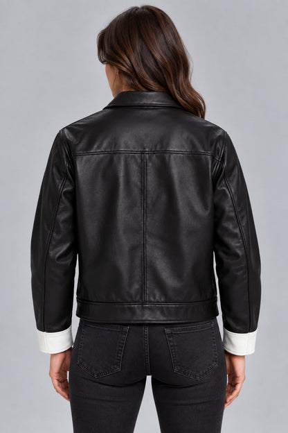 Women’s black and white lambskin leather color block biker jacket back view with bold color block design and clean leather finish