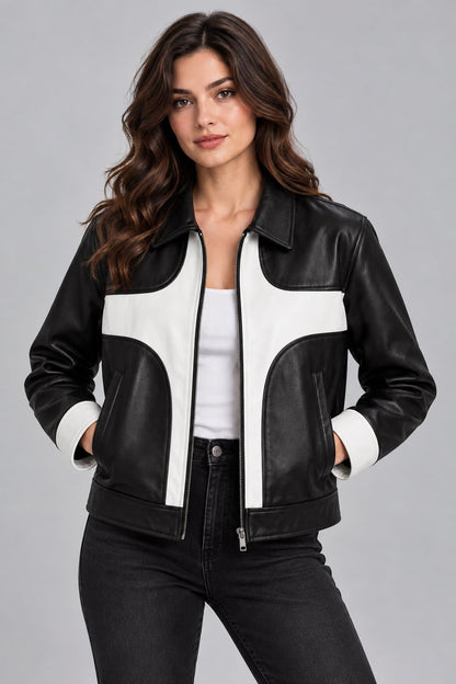 Women’s black and white lambskin leather color block biker jacket front view with bold contrast panels, zipper closure and modern motorcycle styling