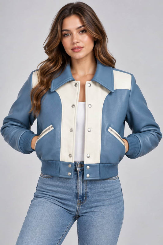 Women’s dusty blue and cream lambskin leather color block bomber jacket front view with ribbed collar, zipper closure and modern color block design