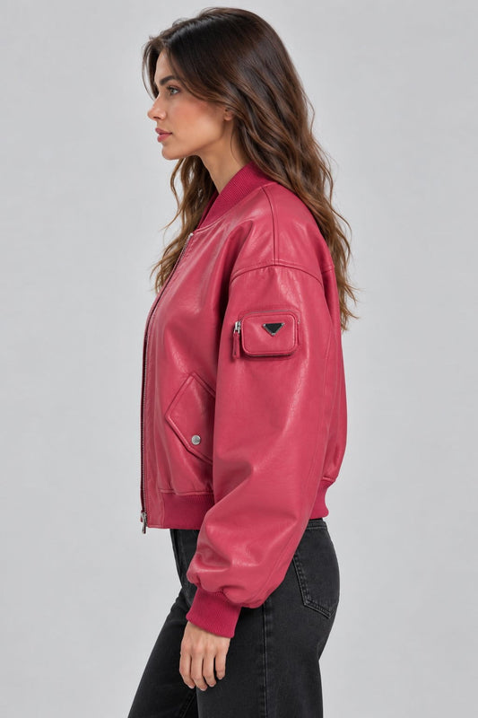 Women’s pink genuine leather oversized bomber jacket side view showing oversized silhouette, long sleeves and ribbed cuffs