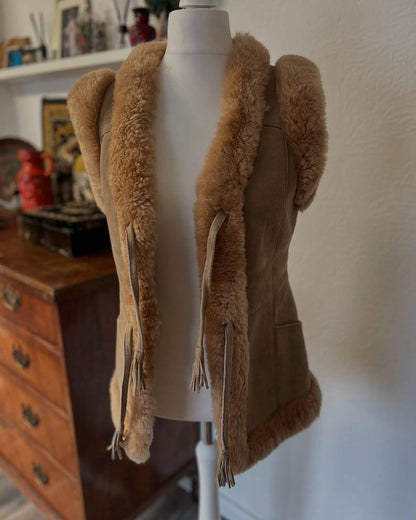 Fringe tie closure on women's suede shearling vest