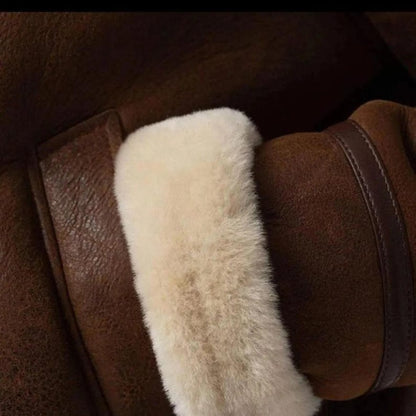 Close-up of shearling cuff on brown leather jacket