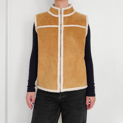 Women's tan suede shearling vest with high collar and zip front