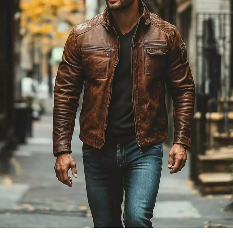 Men's vintage distressed brown leather biker jacket worn outdoors