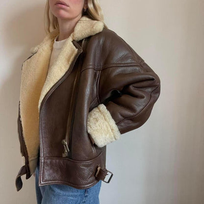 Belt detail on brown sheepskin aviator jacket