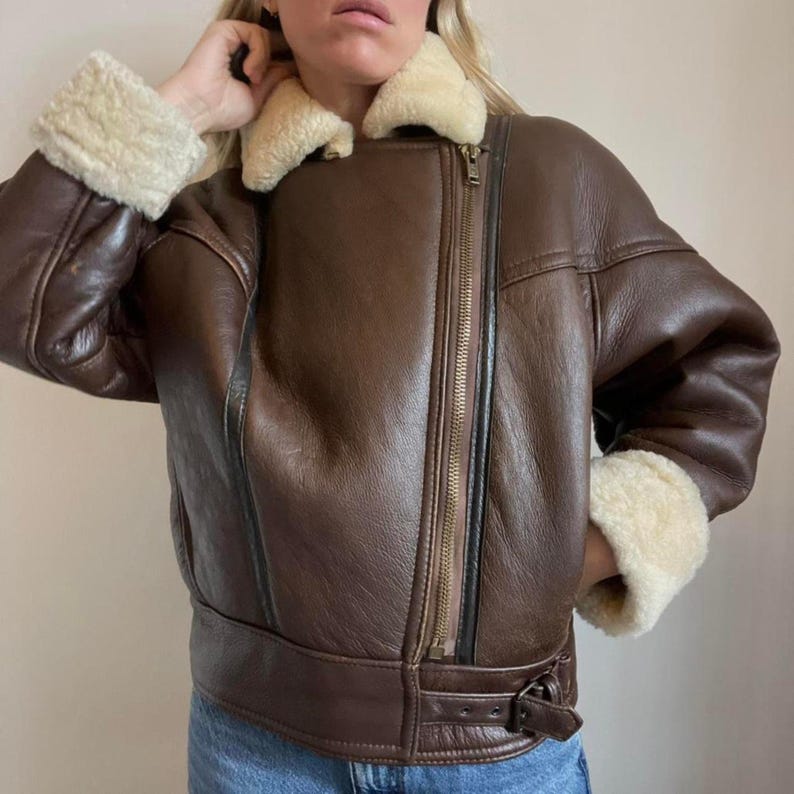 Shearling cuffs on women's oversized brown jacket