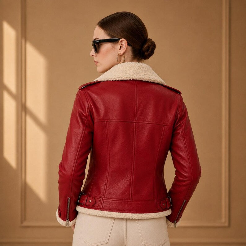 Red belted biker jacket with cream cuffs and quilted shoulders