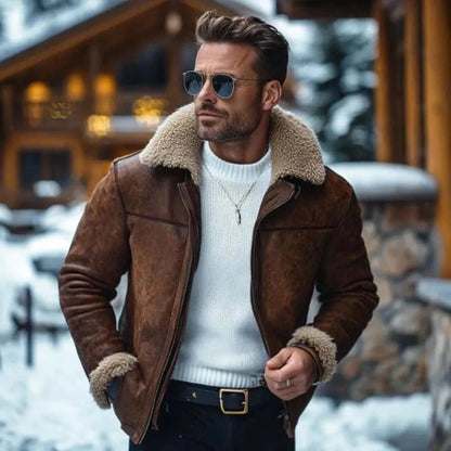 Brown shearling aviator jacket with front zip worn over a white sweater