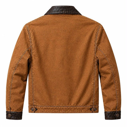 Men's brown leather utility jacket showing black buttoned cuffs