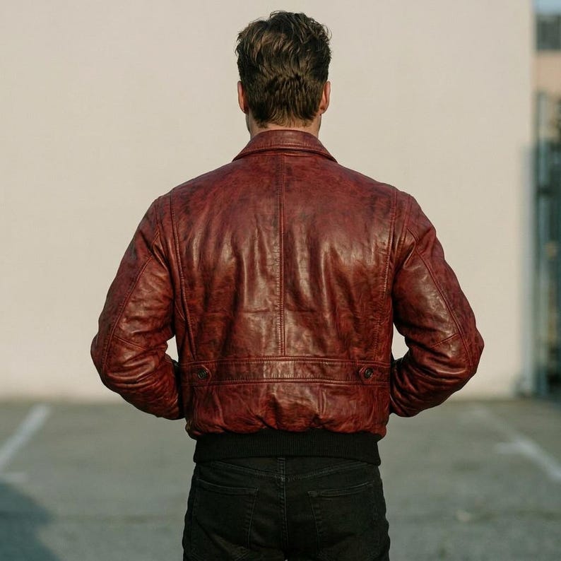 Red distressed sheepskin bomber jacket for men with rib-knit cuffs and hem