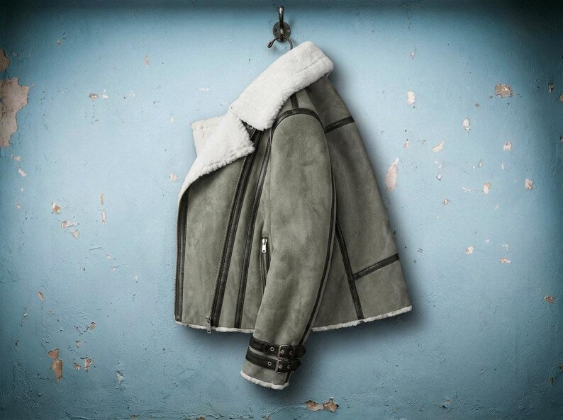 Side view of women's suede jacket with faux fur lining
