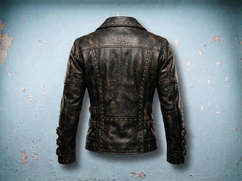 Back of men's steampunk leather jacket with studded yoke and waist buckles