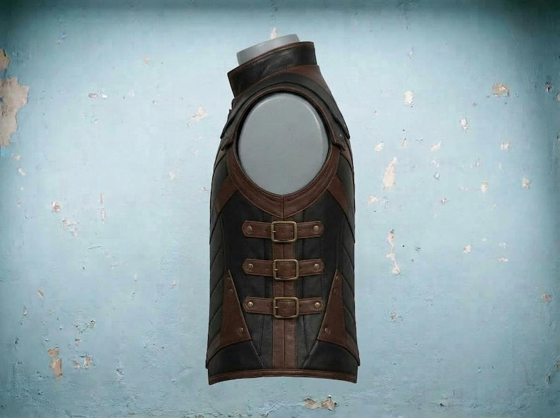 Side of leather armor vest showing three brass buckle straps