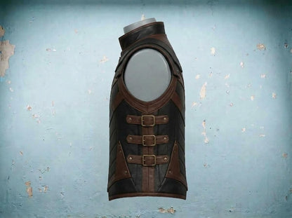 Side of leather armor vest showing three brass buckle straps