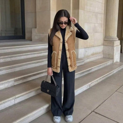 Beige 70s suede vest with cream trim styled with trousers