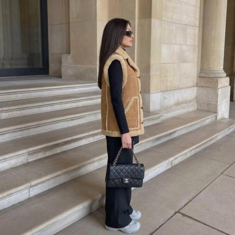 Women's camel suede vest with shearling-style collar styled outfit