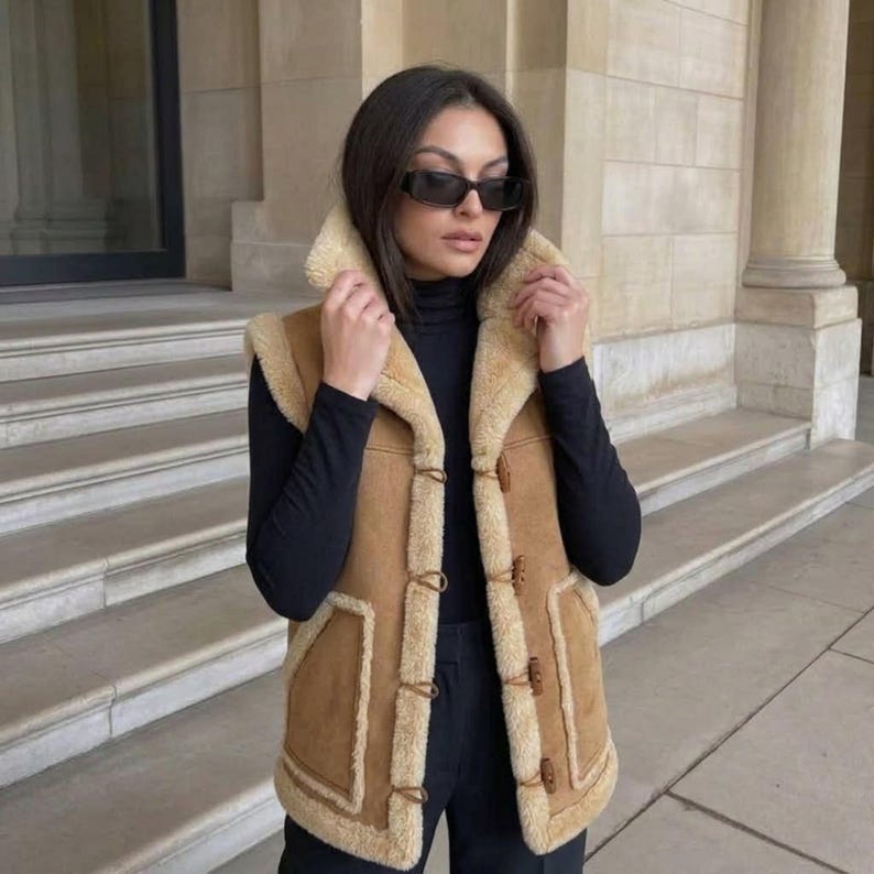 Women's beige suede shearling vest with toggle buttons, product view